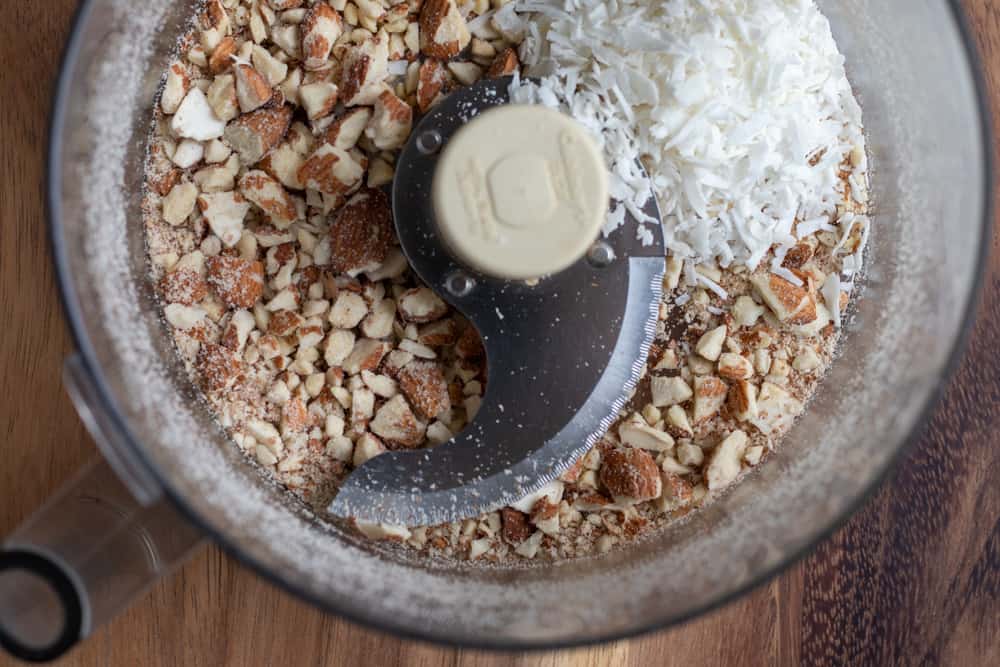 energy bar mixture in bowl of a food processor.