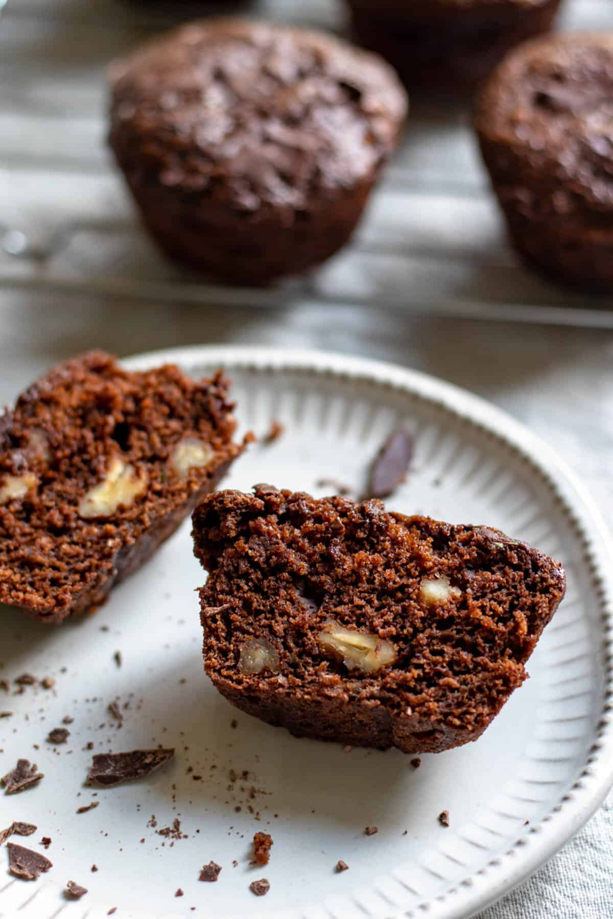 inside of a vegan chocolate zucchini muffin with walnuts.