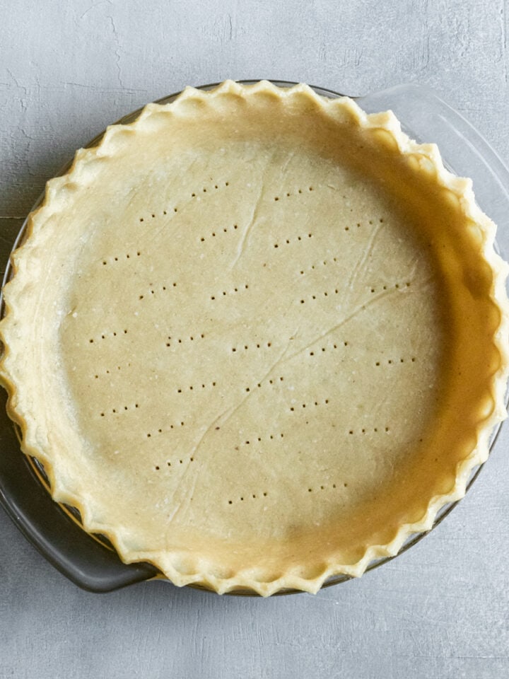 overhead view of crimped unbaked crust in a pie plate