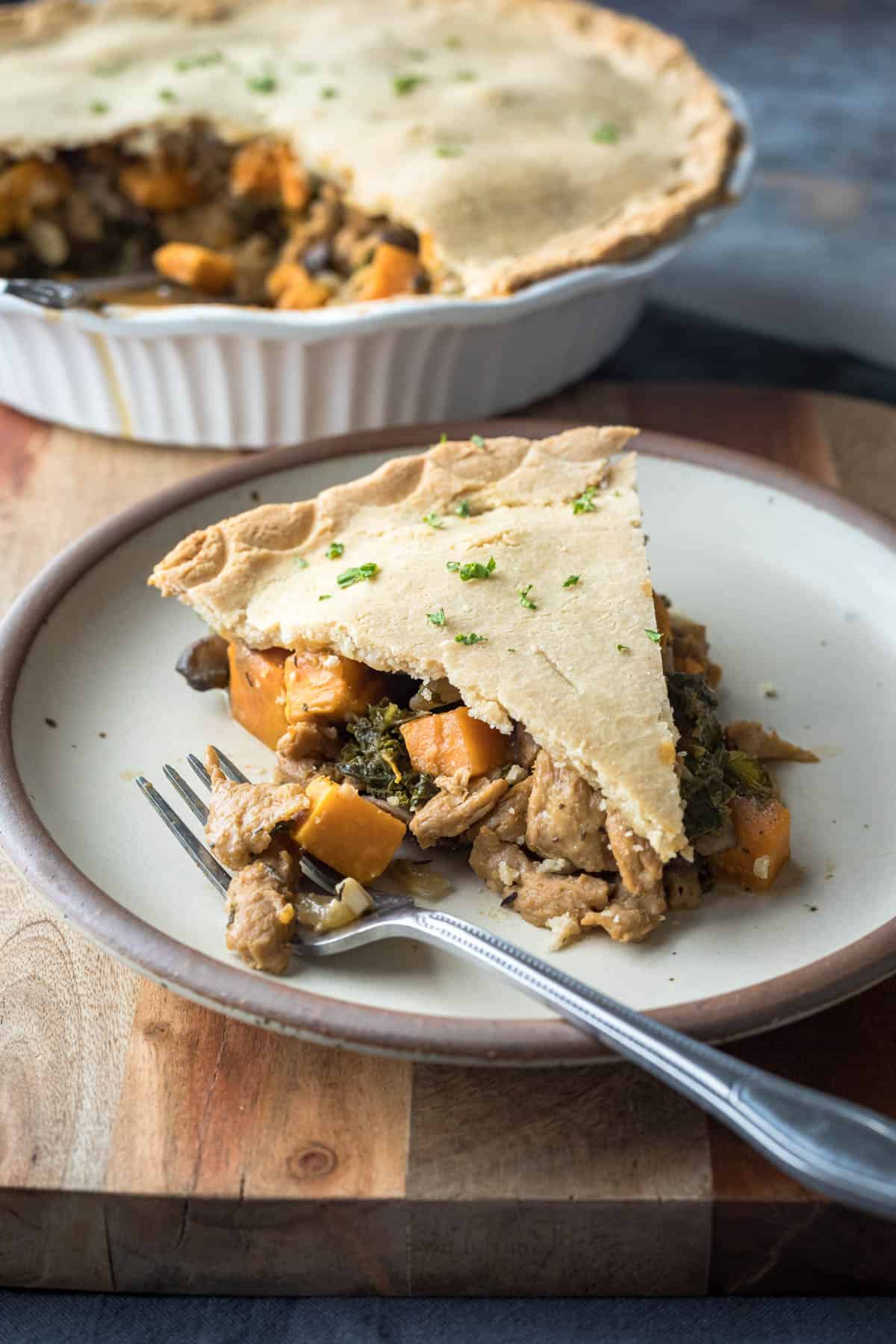 A slice of vegetable pot pie on a small plate.