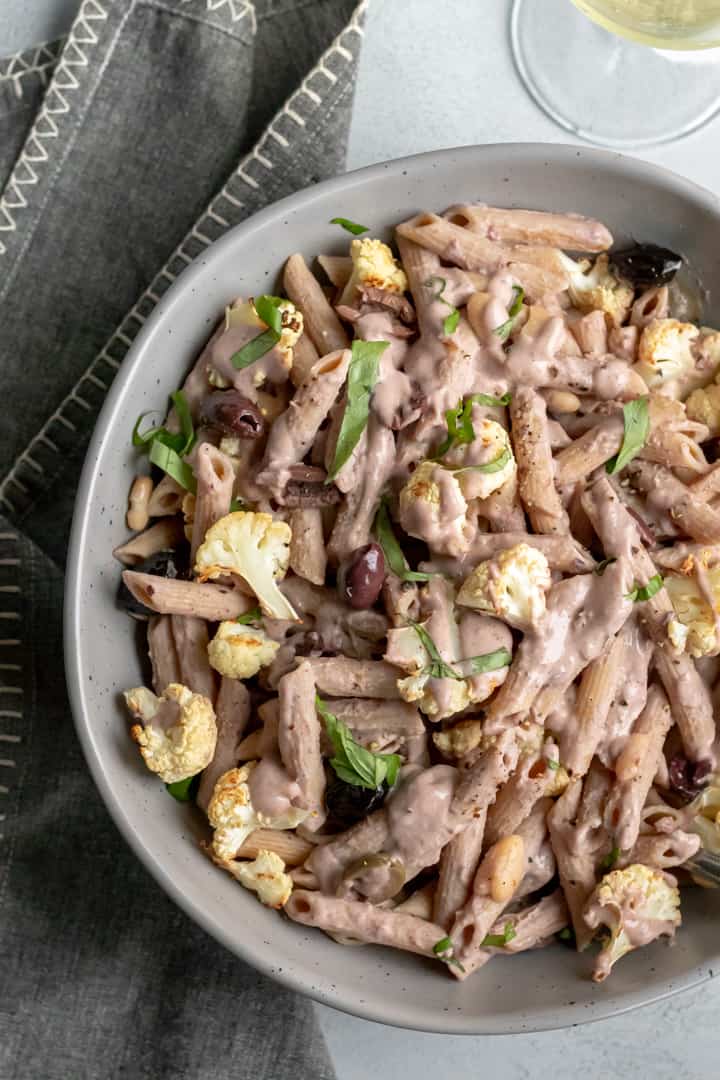 vegan kalamata pasta in a large serving bowl.