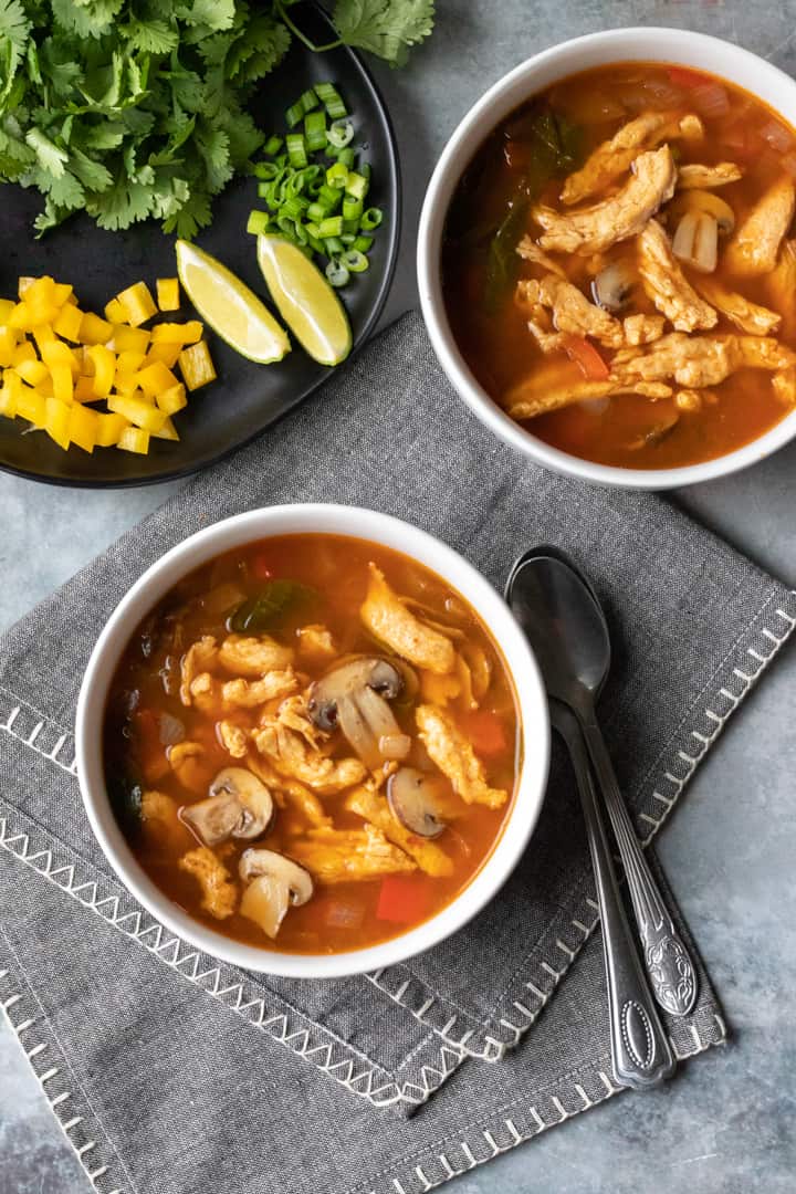 overhead view of Thai soup in bowls.