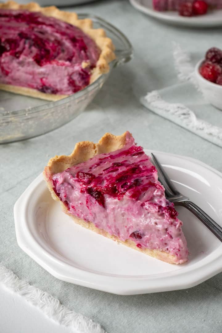 slice of cranberry cream pie on a white plate