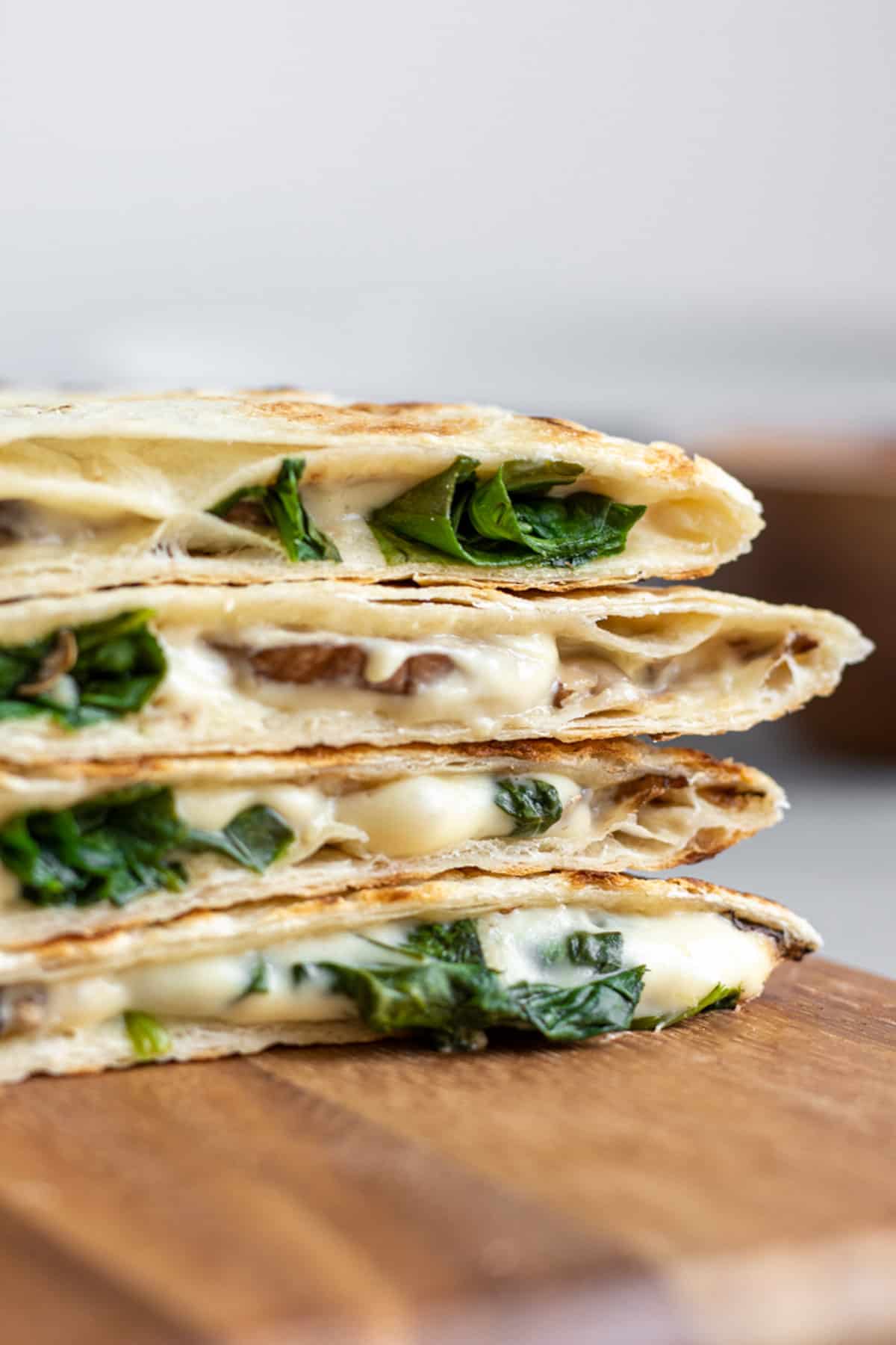 a stack of vegan quesadillas with easy homemade cashew cheese.