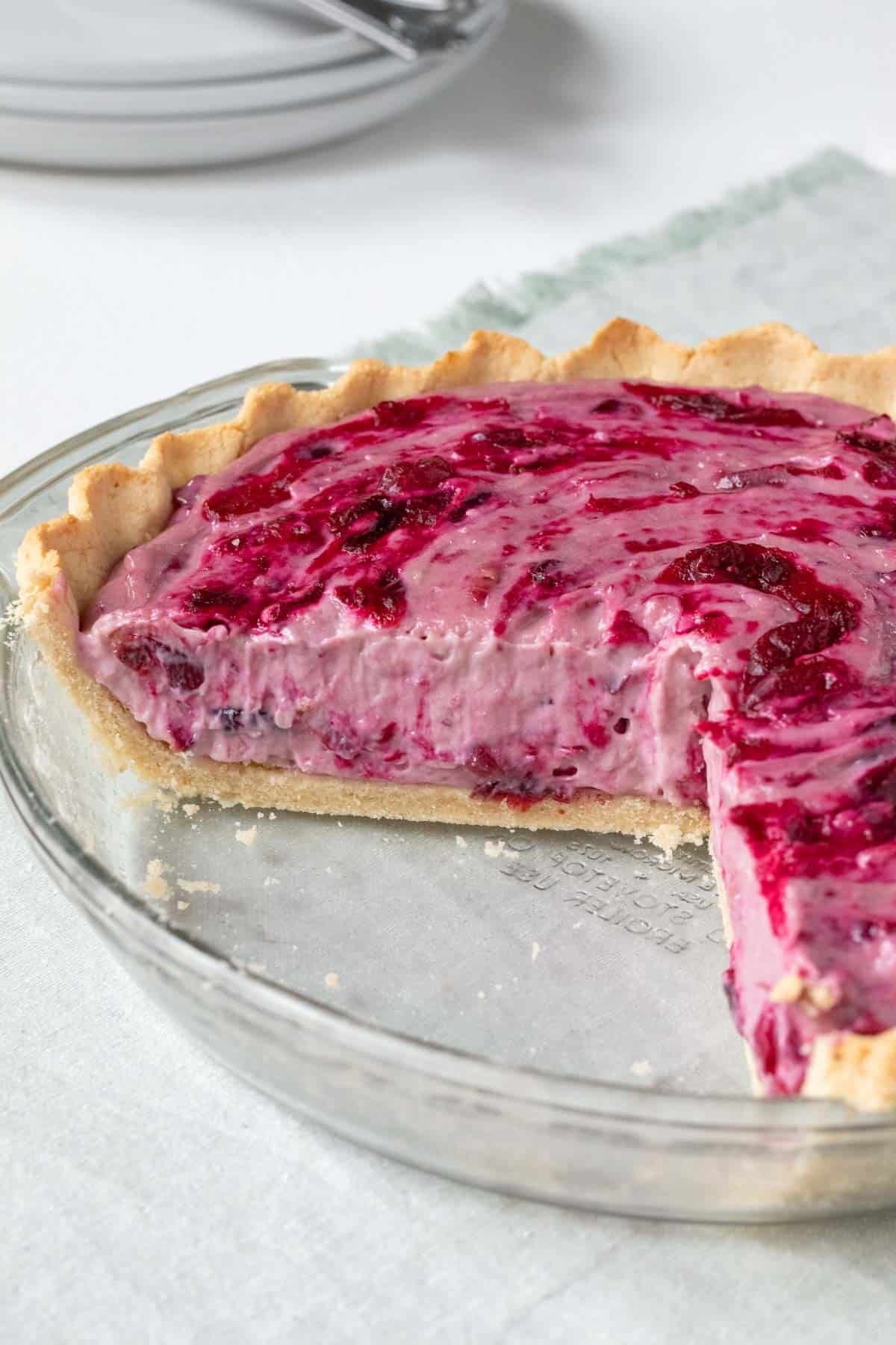 vegan cranberry cream pie in a glass pie plate.