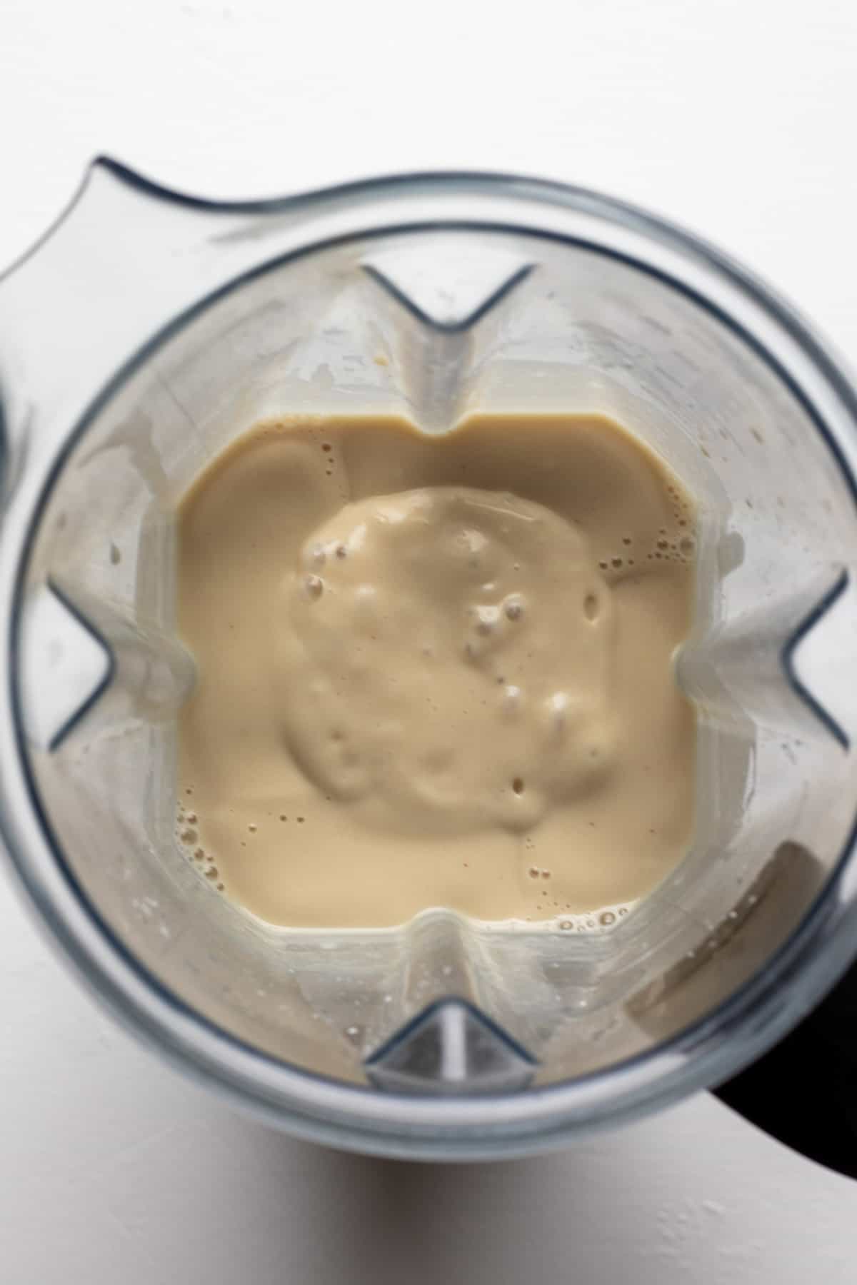 looking inside the blender at the creamy filling mixture.