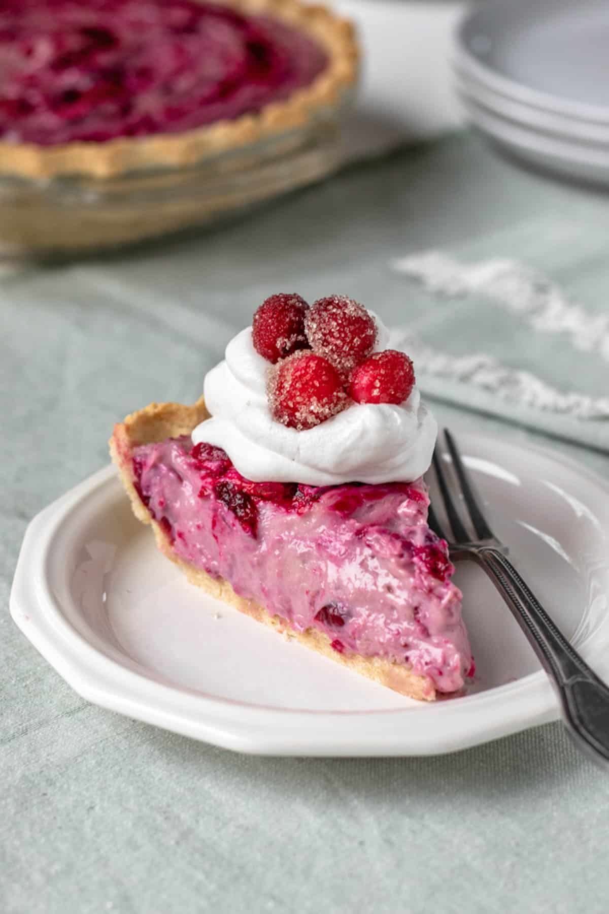 a slice of cranberry cream pie on a plate.