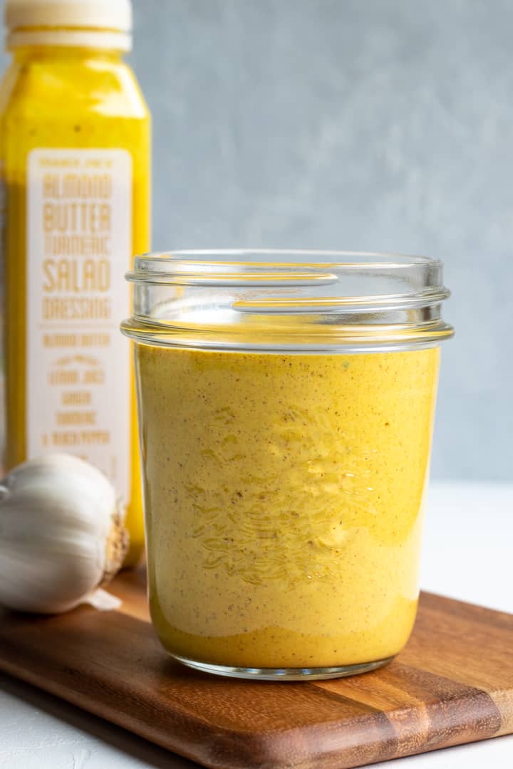 homemade ginger-turmeric dressing in a glass jar.