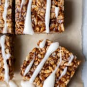 close up of vegan date-sweetened rice krispie treat drizzled with coconut butter glaze