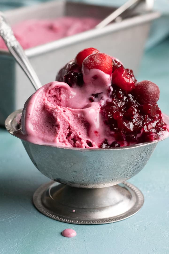 3 scoops of oat ice cream melting in a small silver dish.