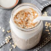 Oat Drink sprinkled with cinnamon and hemp seeds