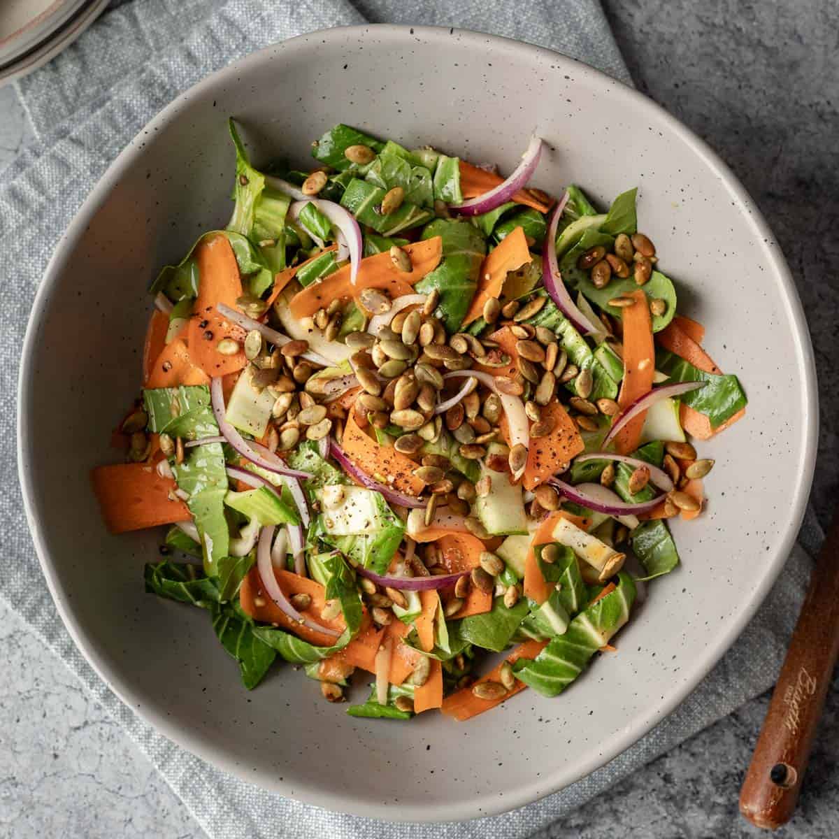 bok choy pear salad in a large serving bowl.