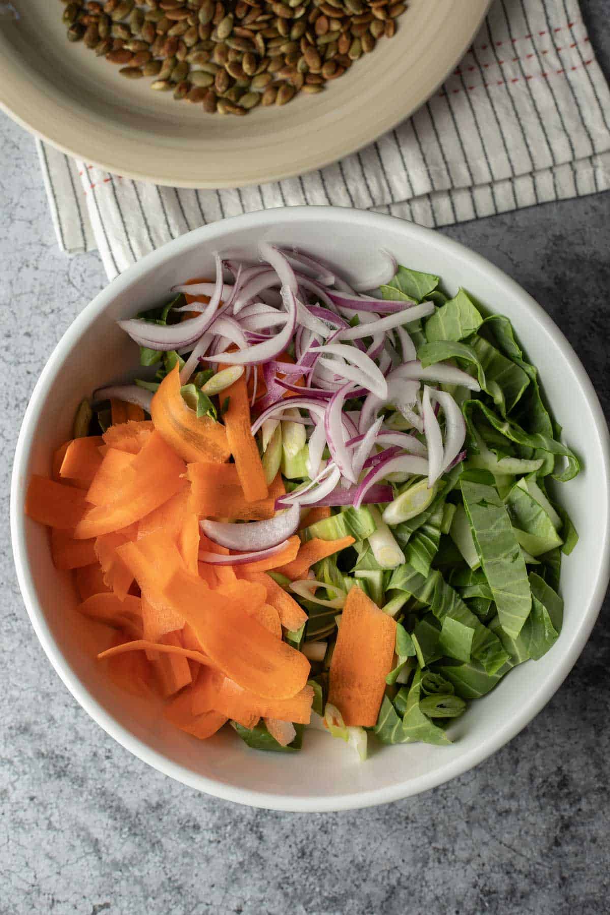 Assembling the salad in a large bowl.