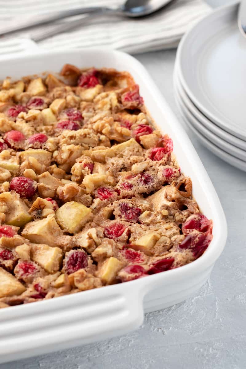 apple cranberry baked oatmeal in a white baking dish.