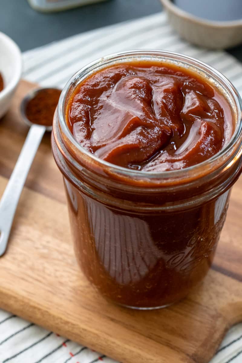 homemade BBQ sauce in a glass jar.