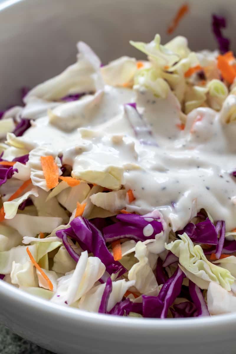 cabbage and vegan coleslaw dressing in a bowl.