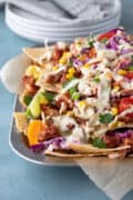 vegan bbq nachos piled on a serving tray