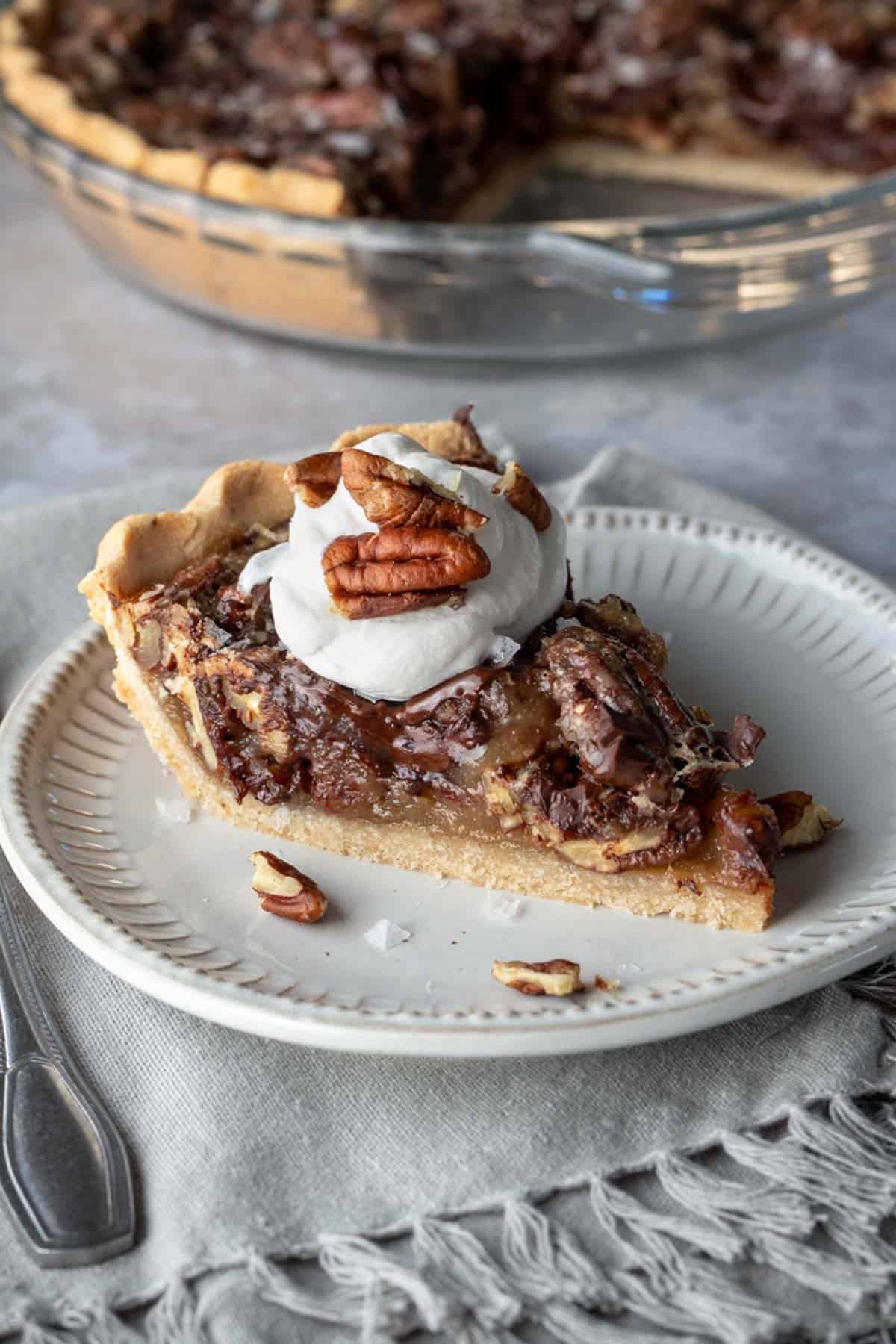 a slice of pie topped with vegan So Delicious Coco Whip.