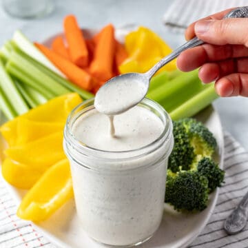 drizzling nut-free ranch from a spoon