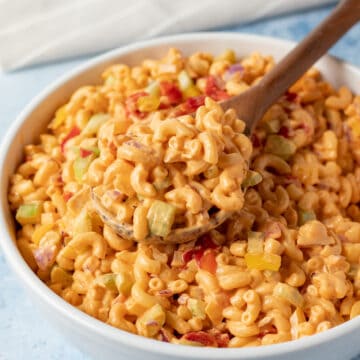 pimento macaroni salad in a large white serving bowl
