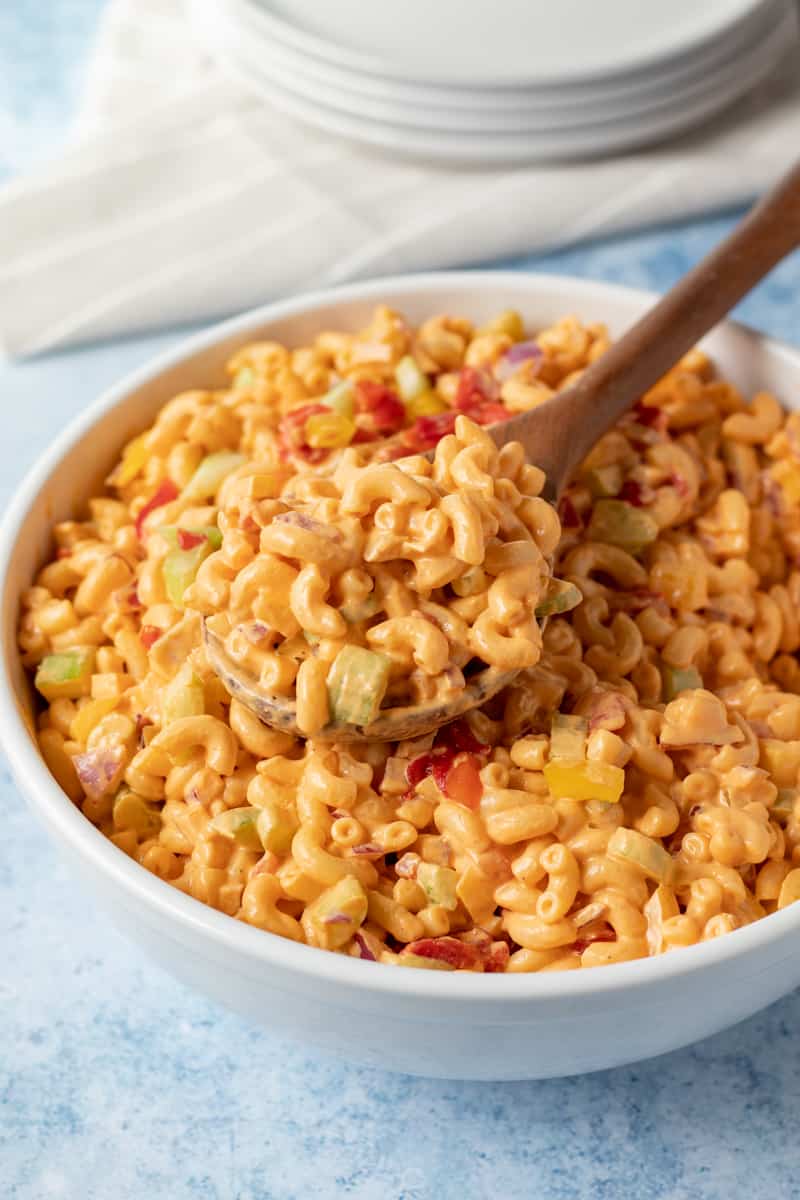pimento macaroni salad in a large white serving bowl.