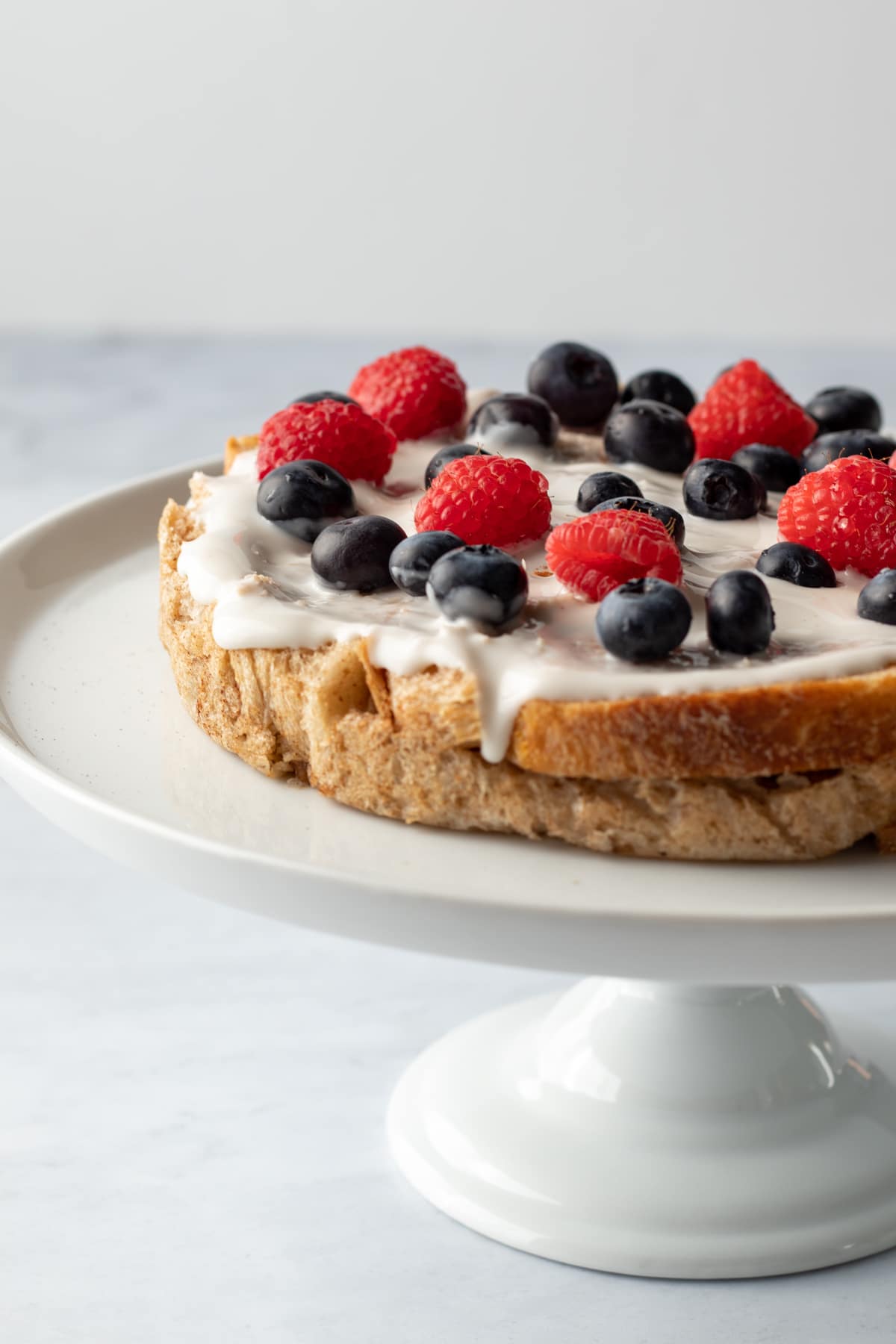 arranging berries on the first layer.