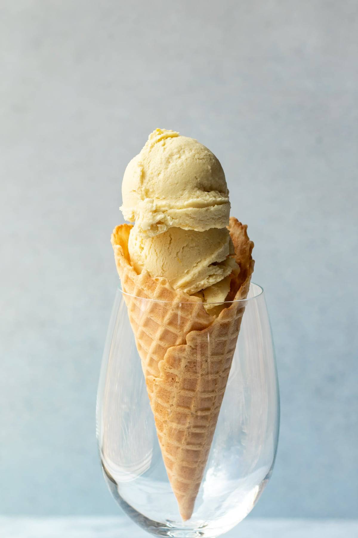 a vegan ice cream cone held upright in a large wine glass.