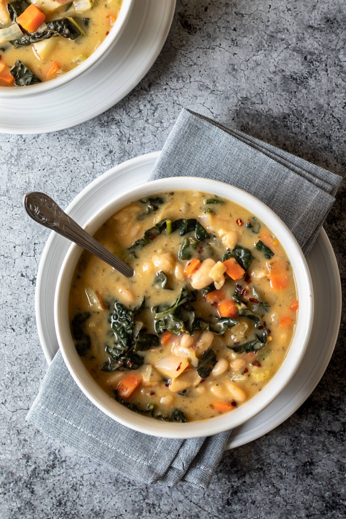 overhead view of soup in white bowls.