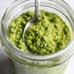 bright green parsley pesto in a glass jar.