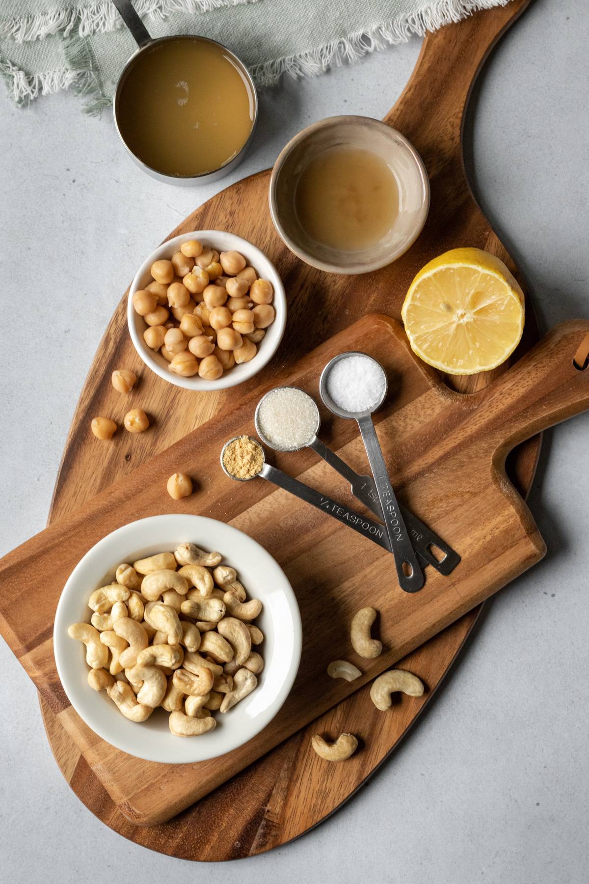 aquafaba mayo ingredients laid out on a cutting board.