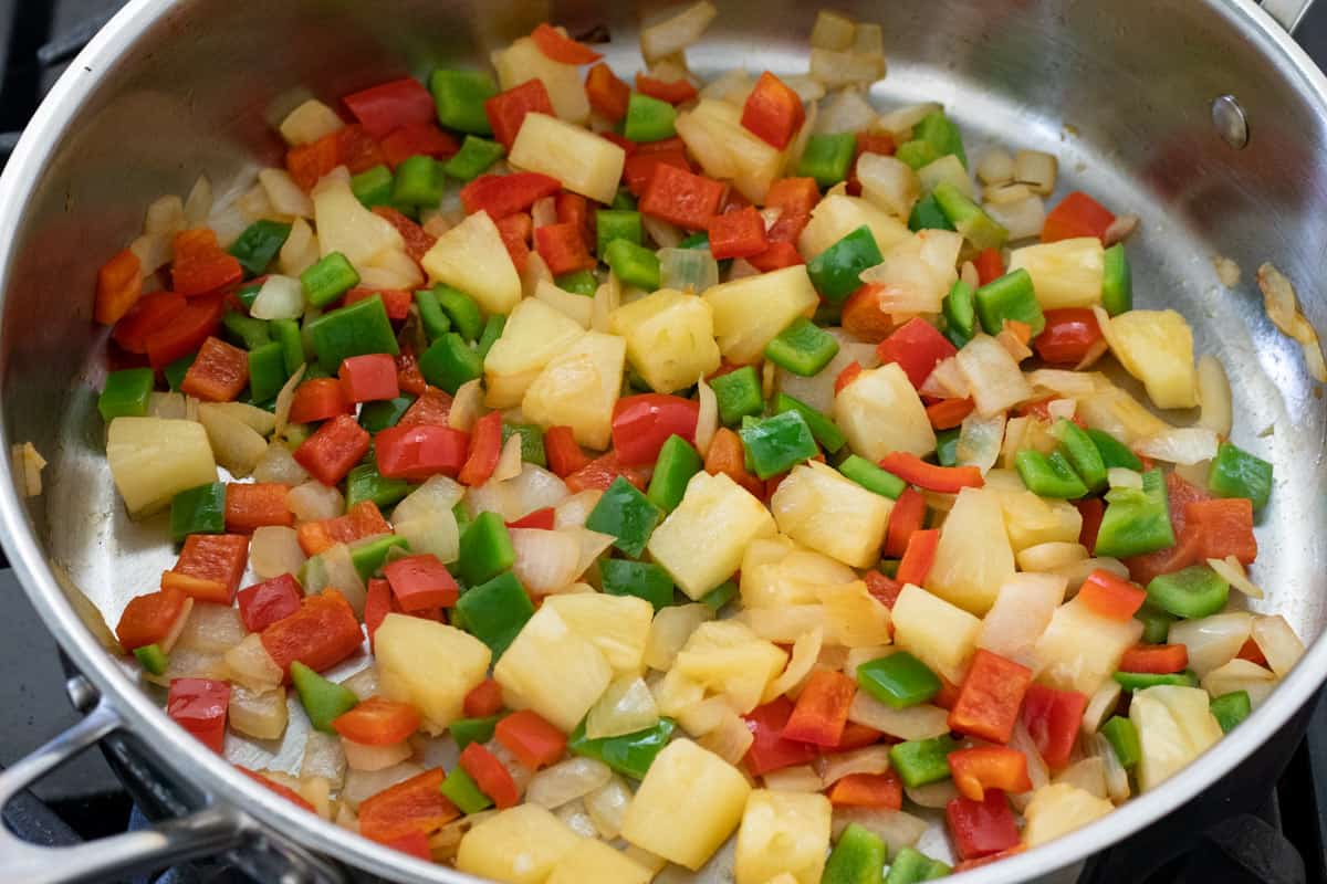 sautéing onion, peppers and pineapple.