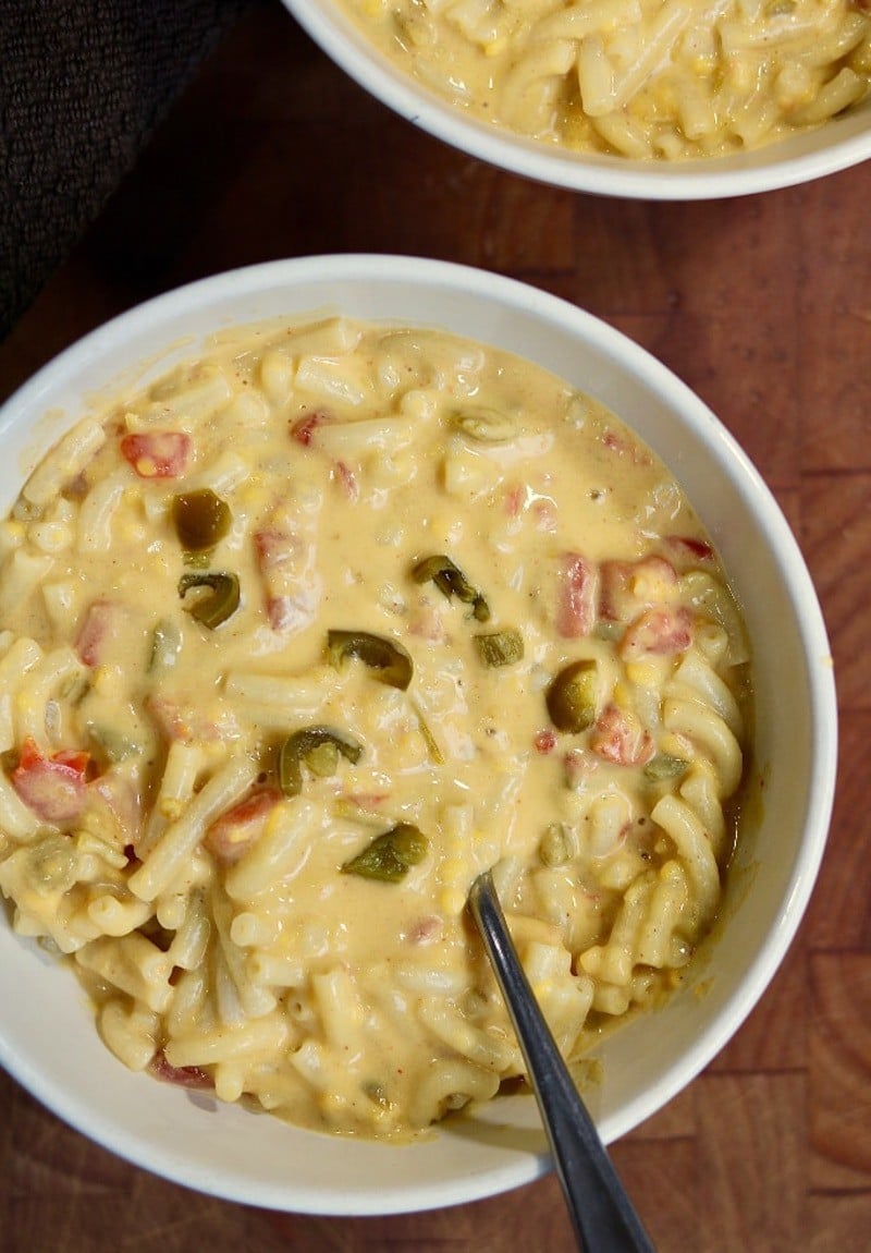 overhead view of super saucy looking mac and cheese in a large white bowl.