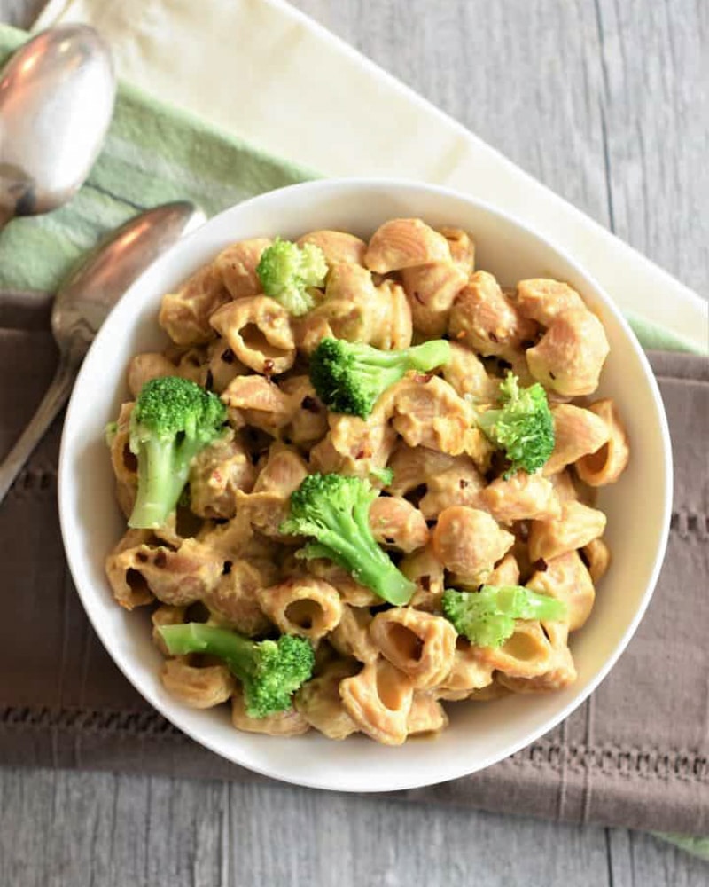 overhead shot, mac with broccoli in a white bowl.