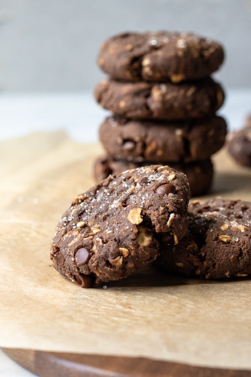 close up of a thick protein cookie studded with oats and chocolate chips.