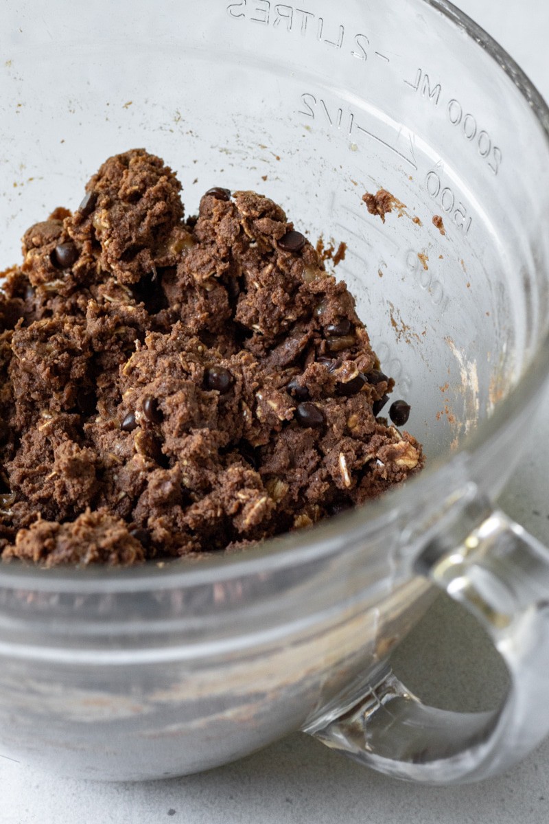 showing the thickness of the cookie batter inside a mixing bowl.