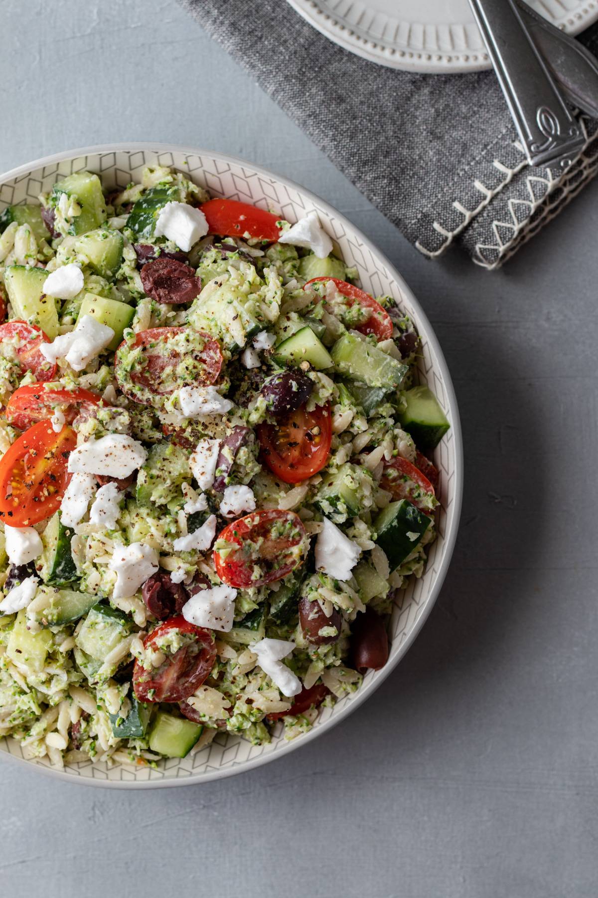 overhead view of orzo salad in a large bowl.