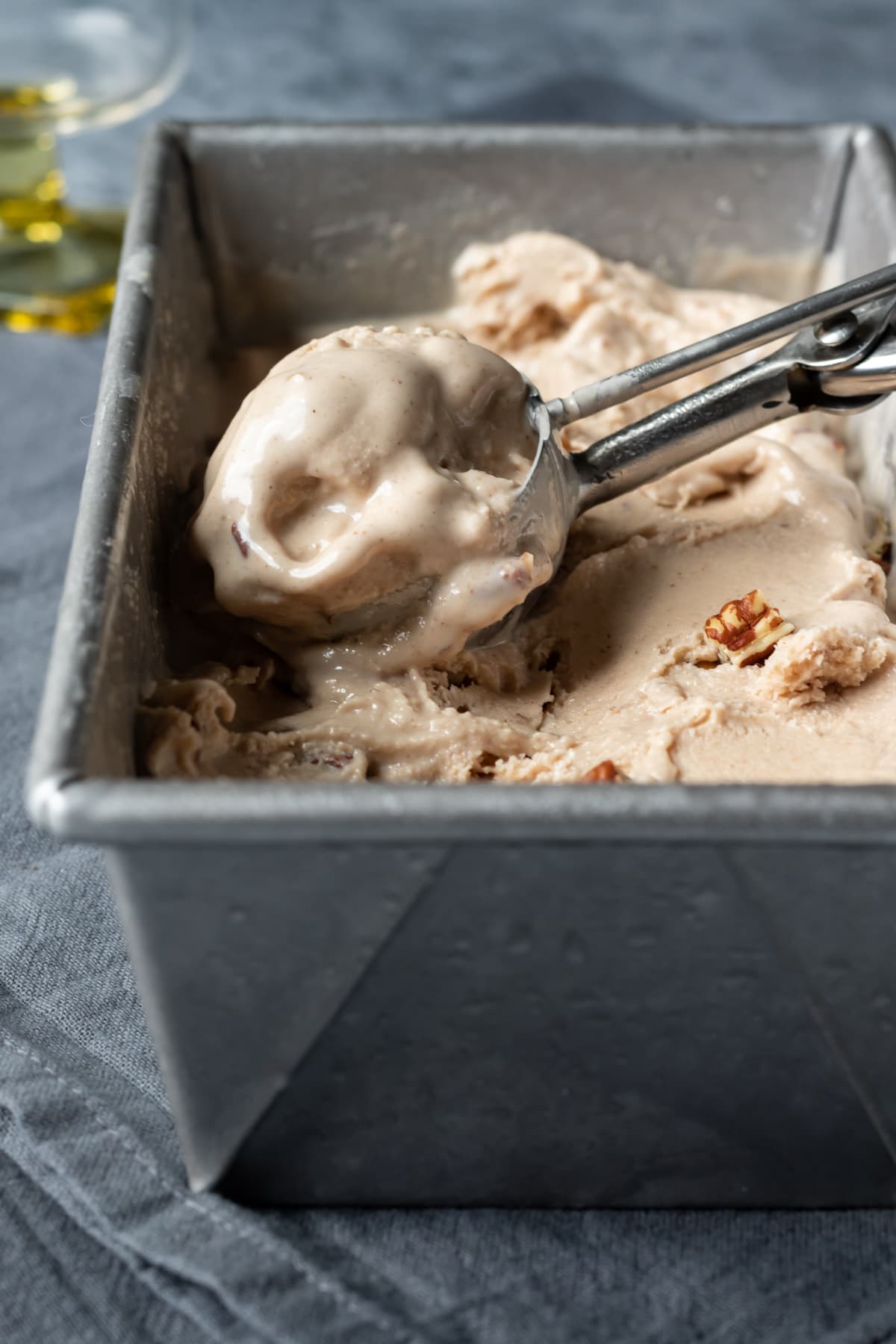 a melty scoop of ice cream in the scooper