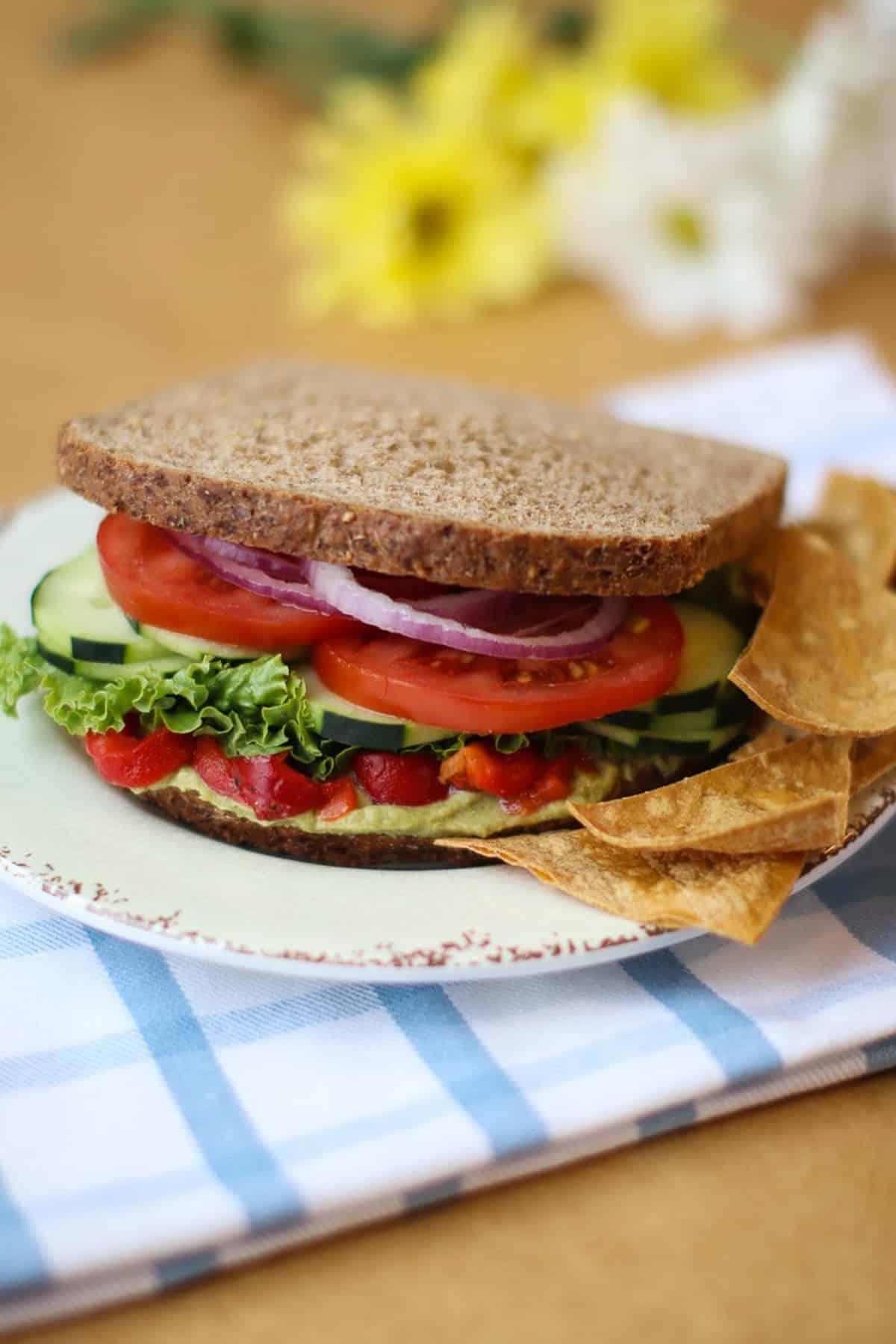 cucumber, tomatoes, lettuce, and other veggies on whole grain bread.