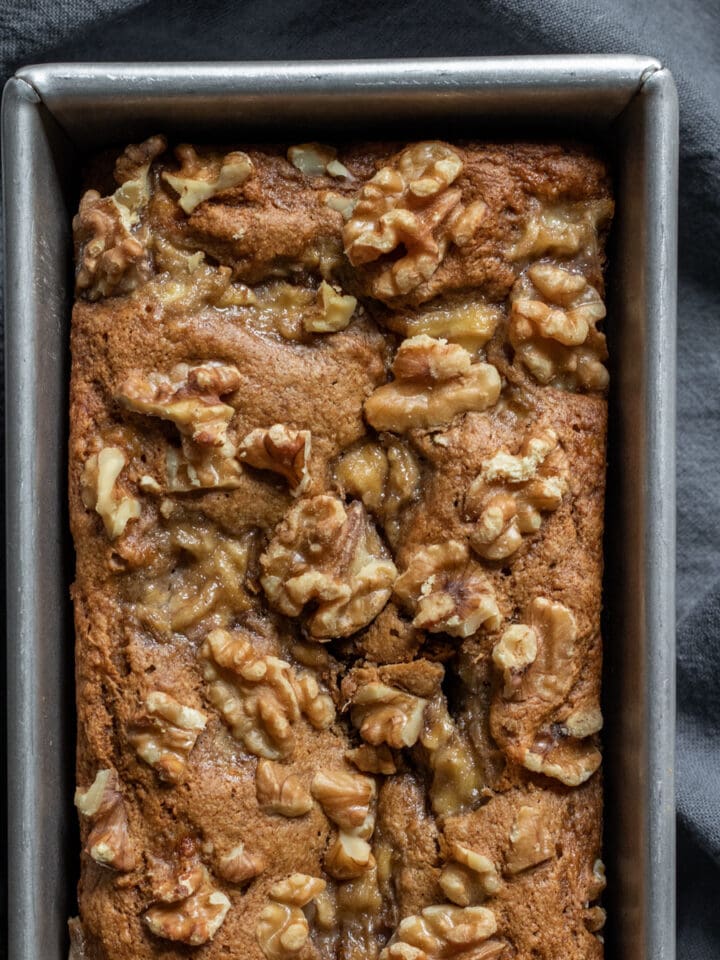 close up overhead of healthy banana bread in a loaf pan