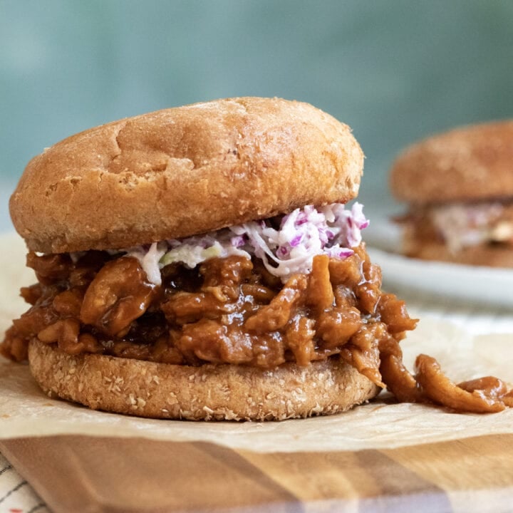 A barbecue soy curl sandwich on whole wheat bun with slaw.
