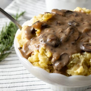 close up of mushroom gravy on mashed potatoes