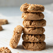 Side view of a tall stack of small cashew cookies