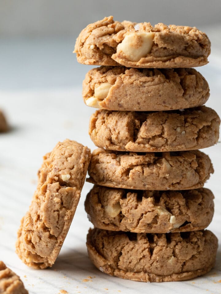 Side view of a tall stack of small cashew cookies