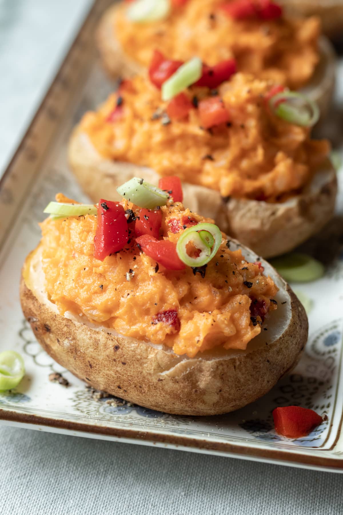 close up of vegan twice baked potatoes on a serving platter
