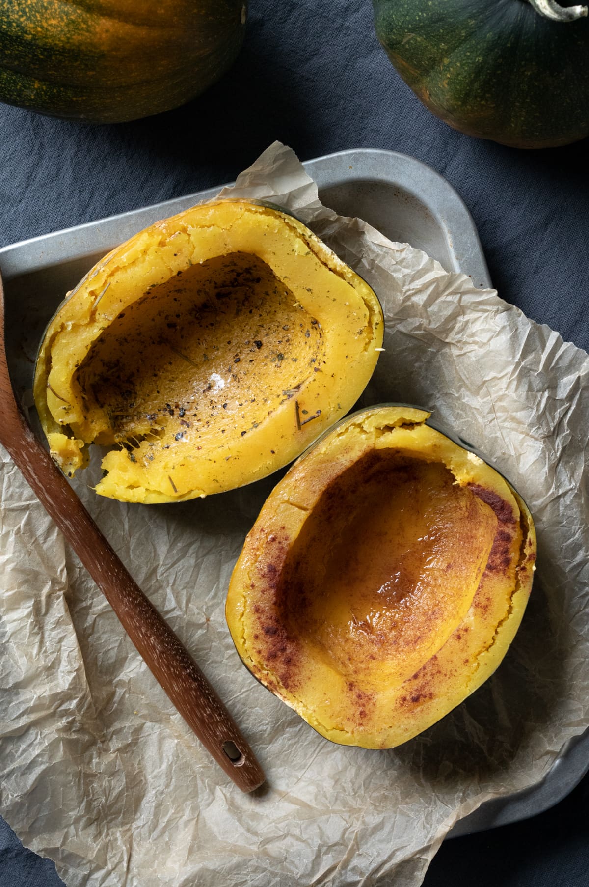 two seasoned halves of acorn squash that were pressure cooked.