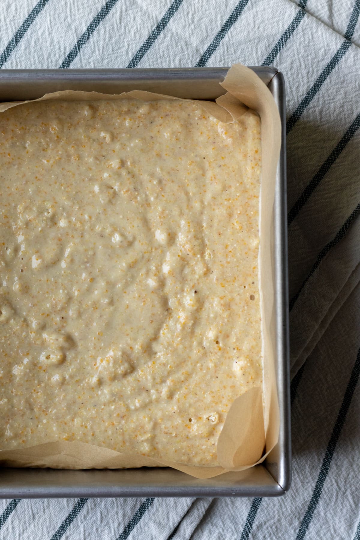 batter poured into a parchment-lined pan