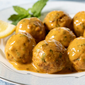 close up of saucy tempeh meatballs