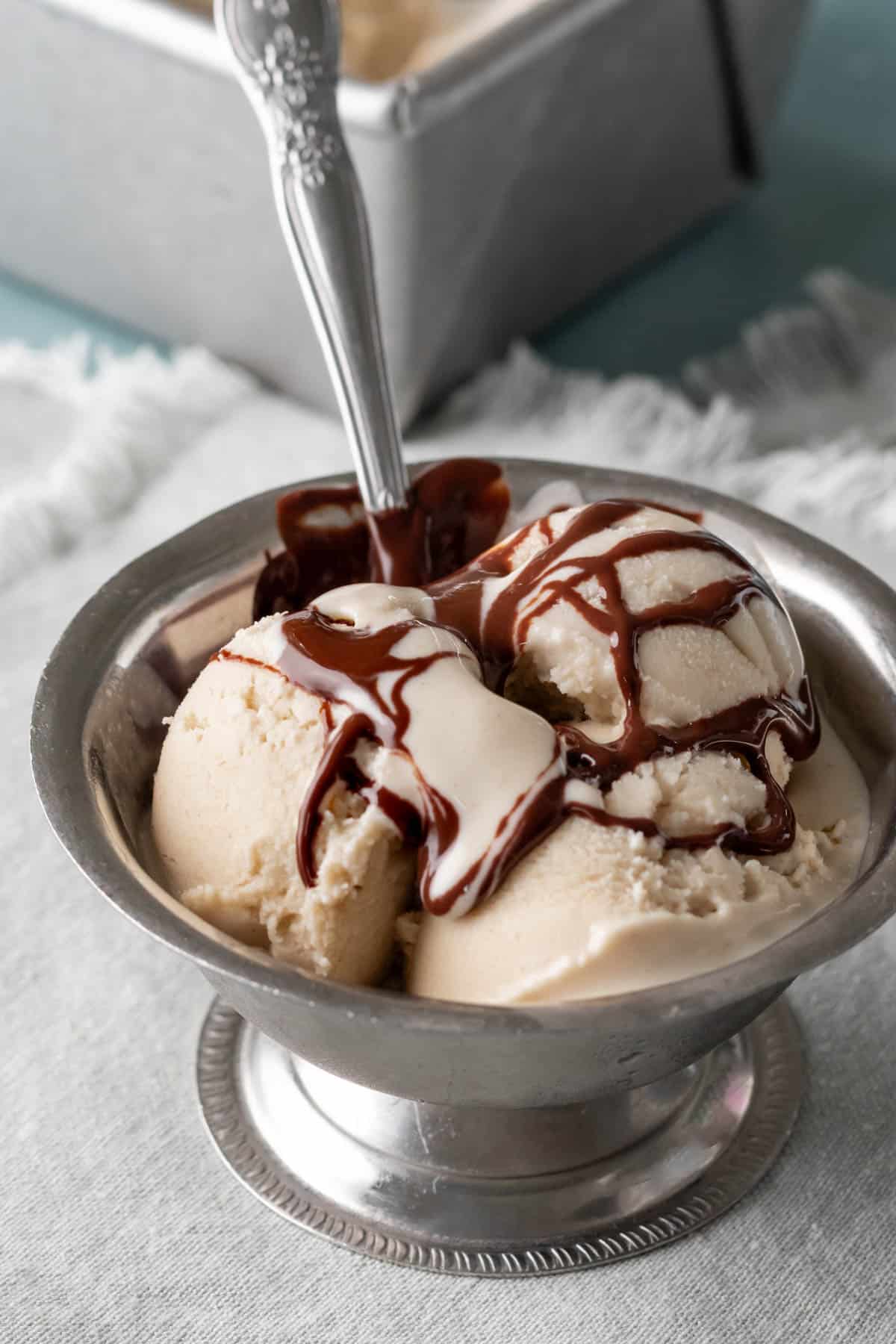 chocolate sauce drizzled on oat milk ice cream