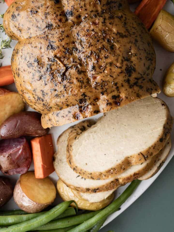 top of seitan turkey roast showing texture of skin and interior meat.