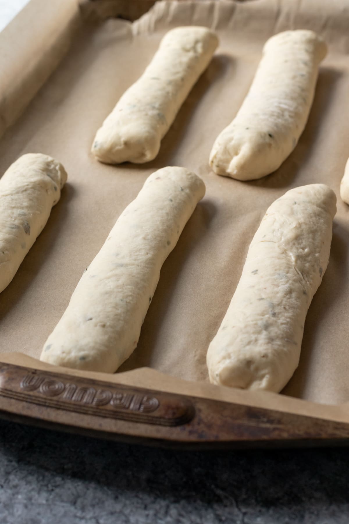 arrange stuffed breadsticks on a parchment lined pan.